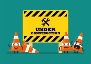 Under construction sign and traffic cones character. Vector illustration